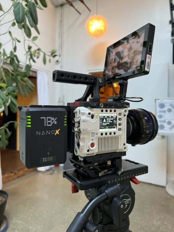 Core SWX NANO X battery mounted on a professional cinema camera, providing reliable power during an outdoor film production.