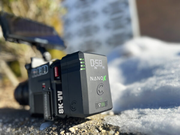 Videographer packing the ultra-compact NANO X battery in a gear bag, highlighting its travel-friendly design for on-the-go creators.